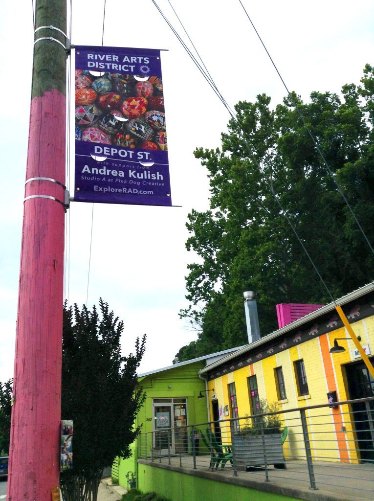 Wayfinding banners in the River Arts District Asheville help locals and tourists find Asheville artists. 