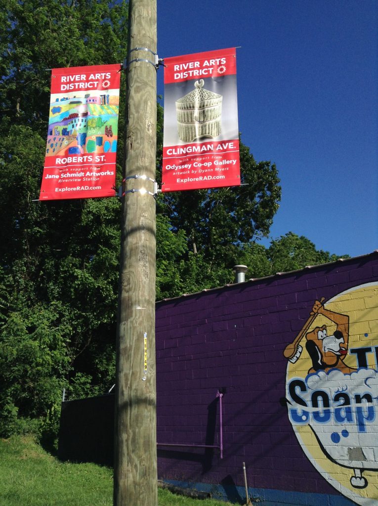 Wayfinding banners in the River Arts District Asheville help locals and tourists find Asheville artists. 