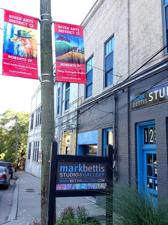 Wayfinding banners in the River Arts District Asheville help locals and tourists find Asheville artists. 