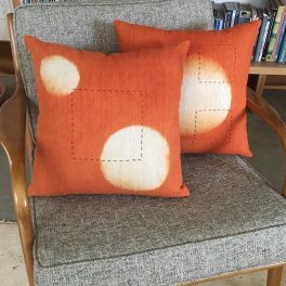 Two-orange-linen-pillows-modern-design