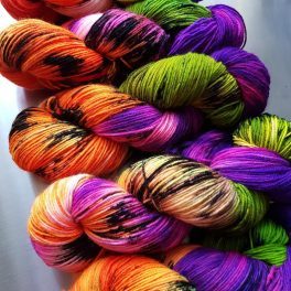 hand-dyed yarn in orang, purple and green