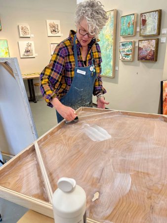 Cindy at work in her Asheville River Arts District studio.